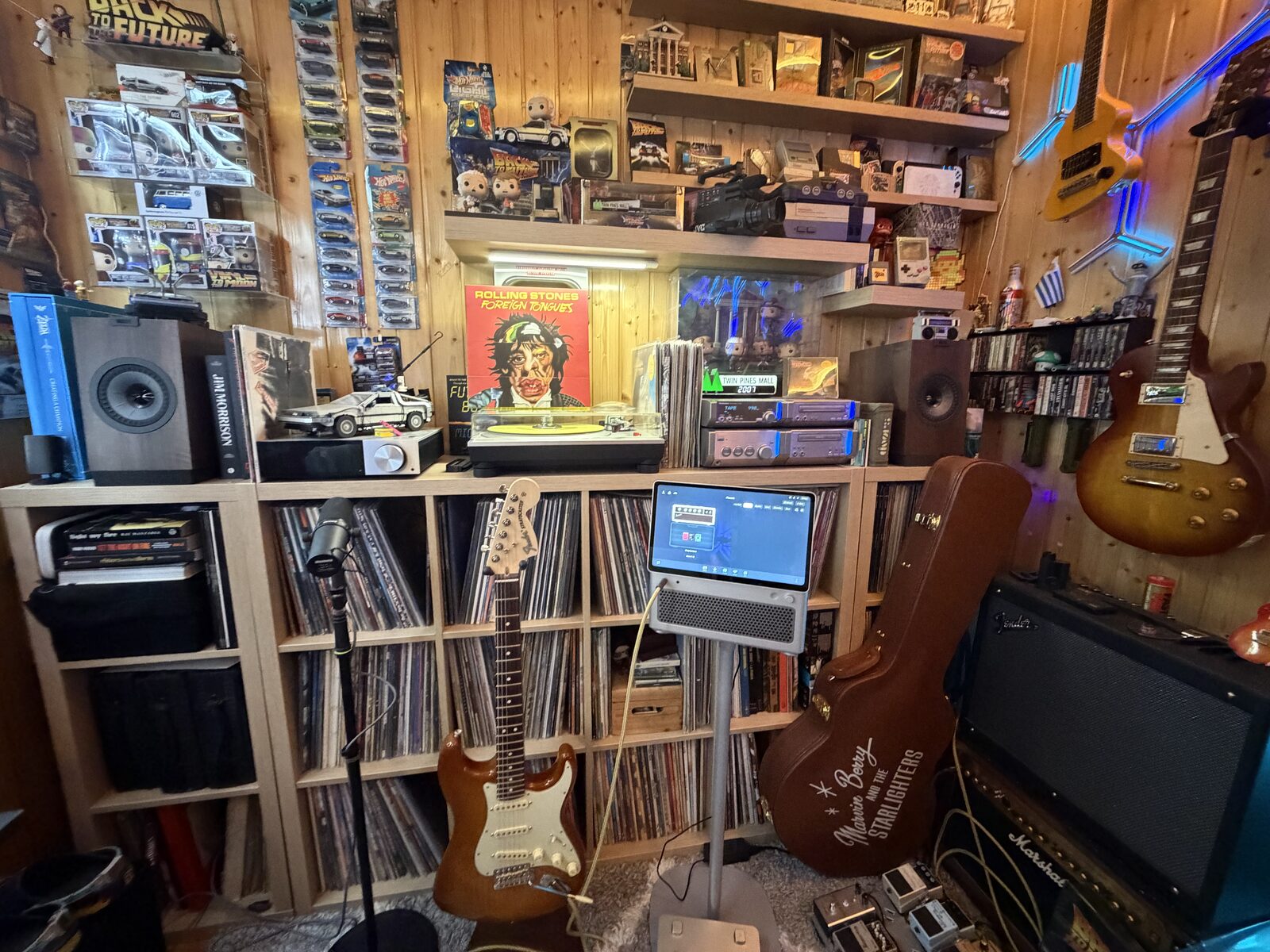 Our home music room — walls of vinyl, guitars and a lot of Back to the Future